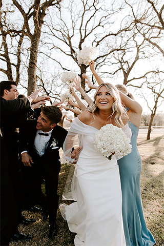 bride and groom with party