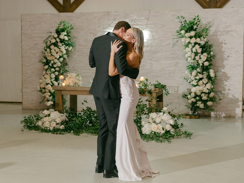 bride and groom dancing on the ballroom floor