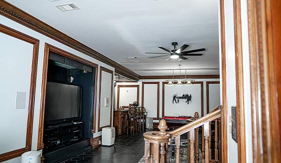 grooms room with huge tv and bar