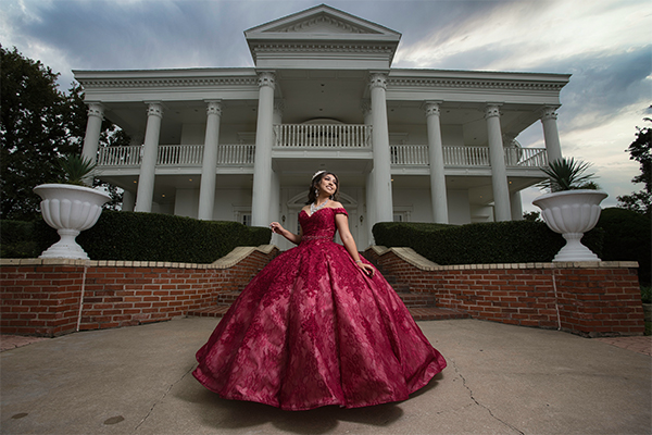Girl in a big red laced Quinceañeras dress