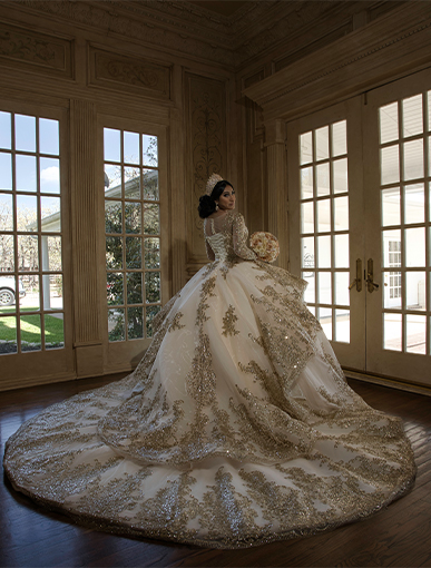 Girl in a white and gold Quinceañeras dress