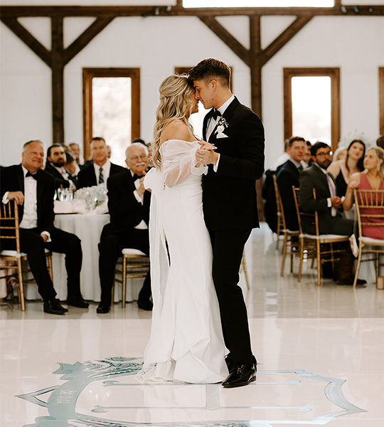 bride and groom first dance on the floor