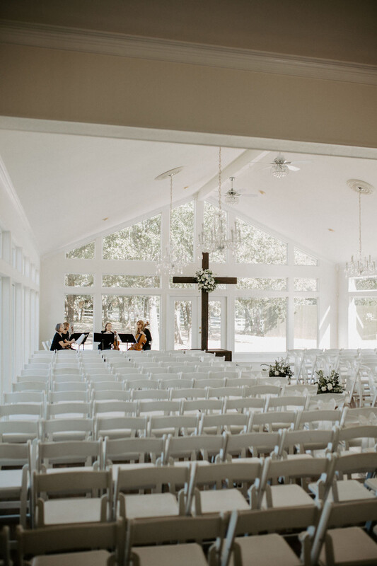 a band setting up in the ceremony area