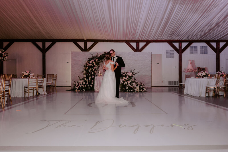 bride and groom dancing in the ballroom