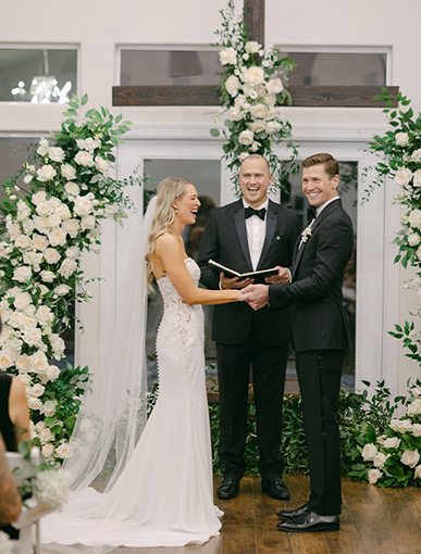 bride and groom laughing as they give vows