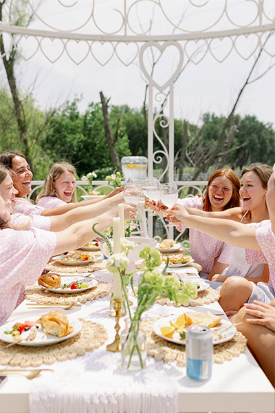 a bridal party having a brunch picnic